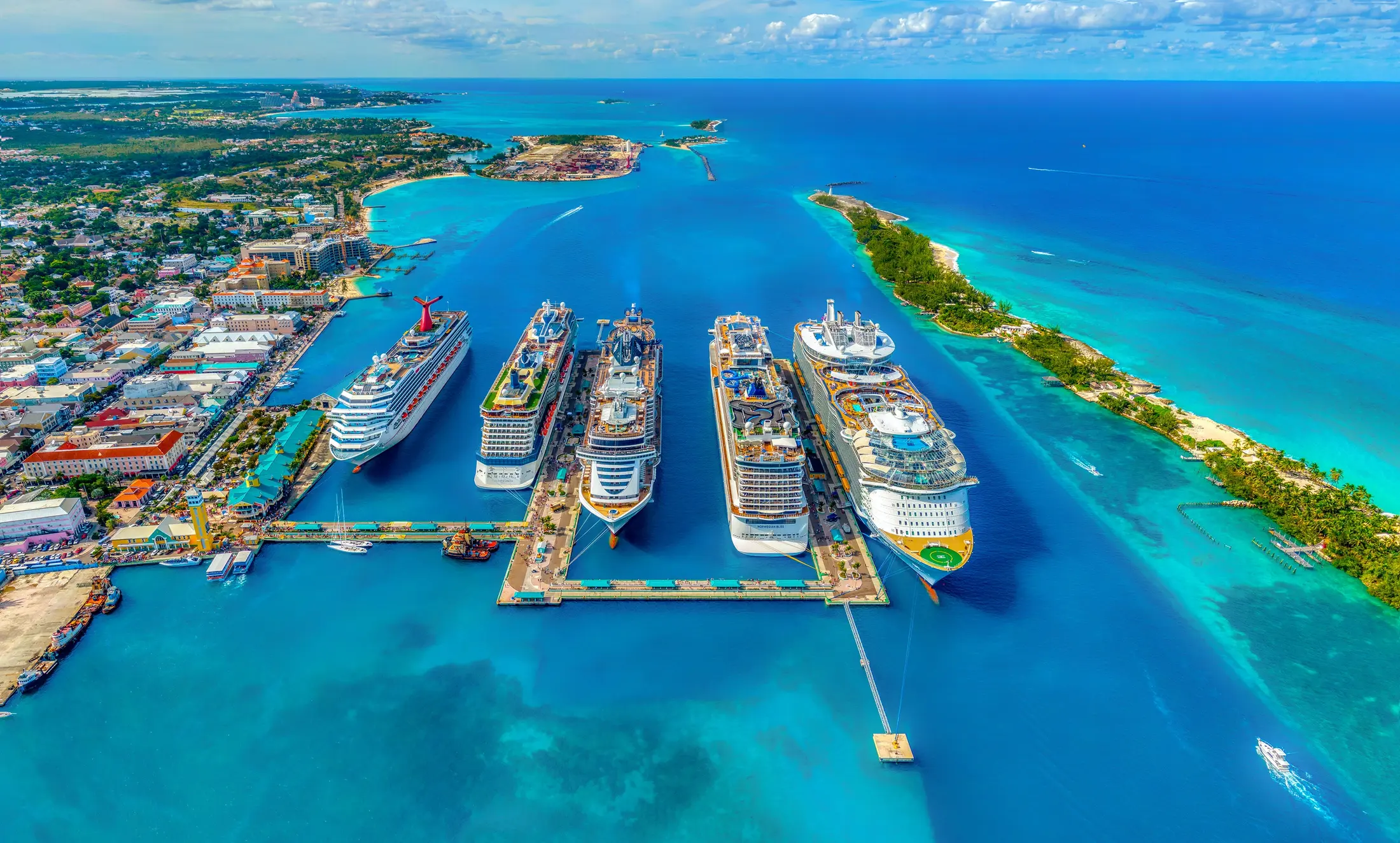 Cruise ships surrounded by brilliant turquoise water