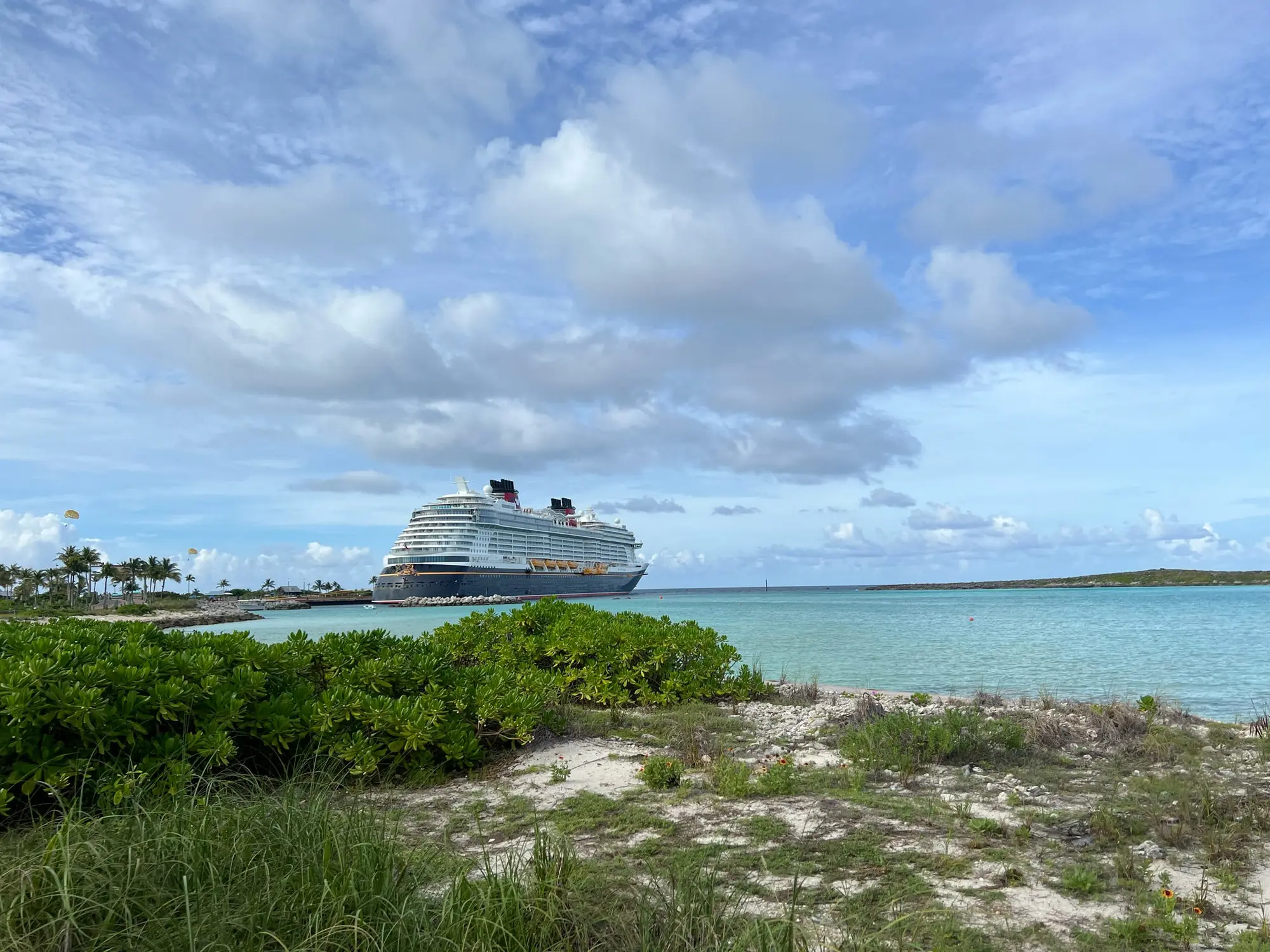 Disney Cruise Line ship sailing beside Castaway Cay