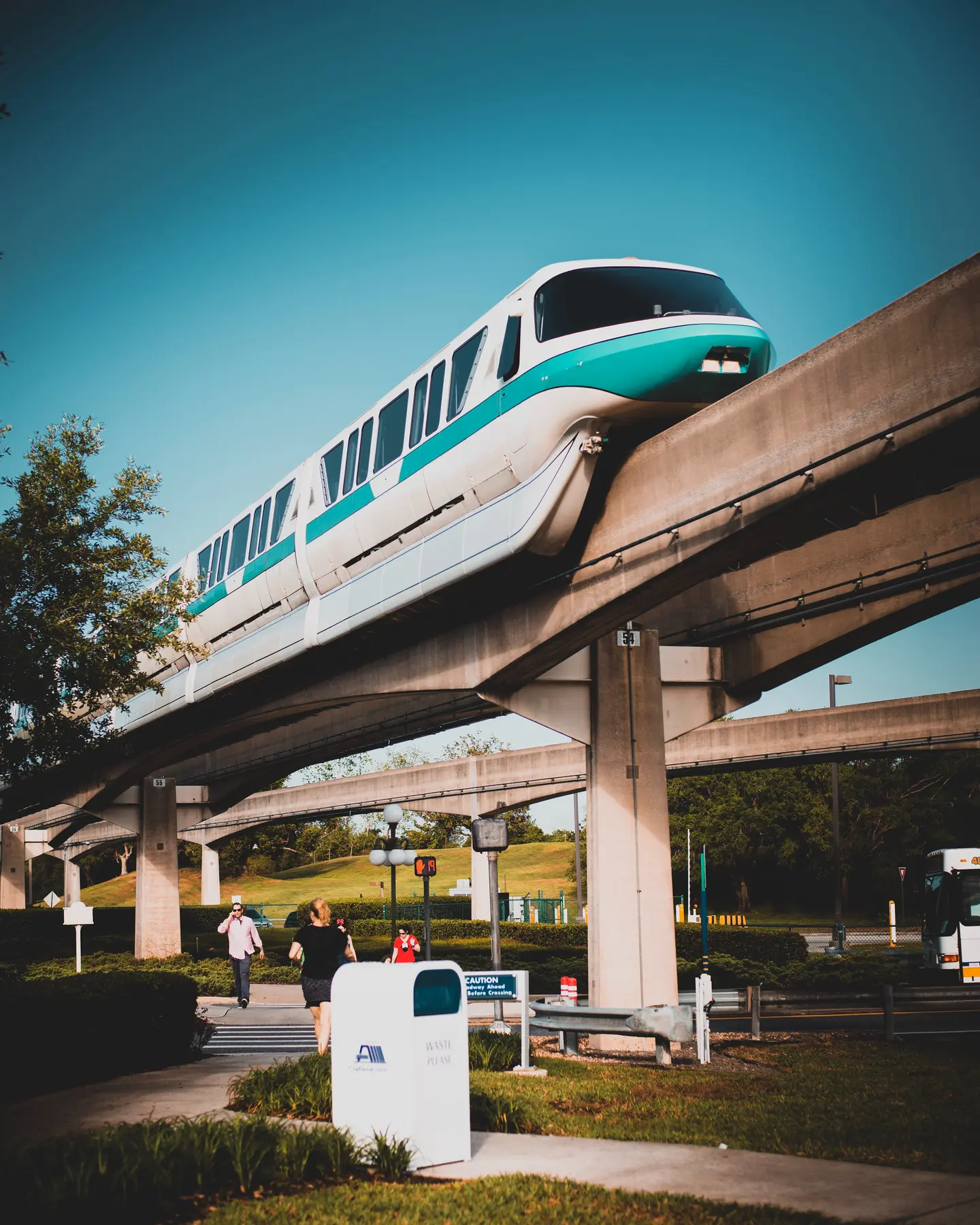 A Disney monorail gliding above the resort walkway