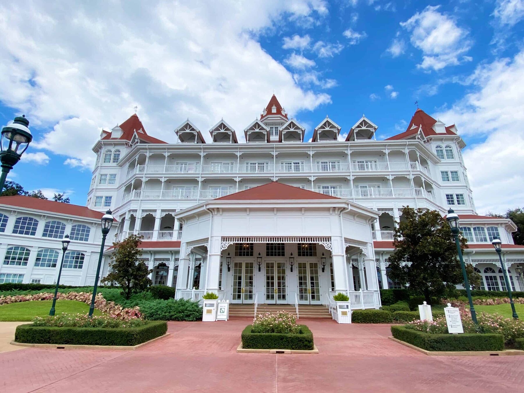 The Villas at Disney’s Grand Floridian Resort and Spa exterior beneath a bright sky