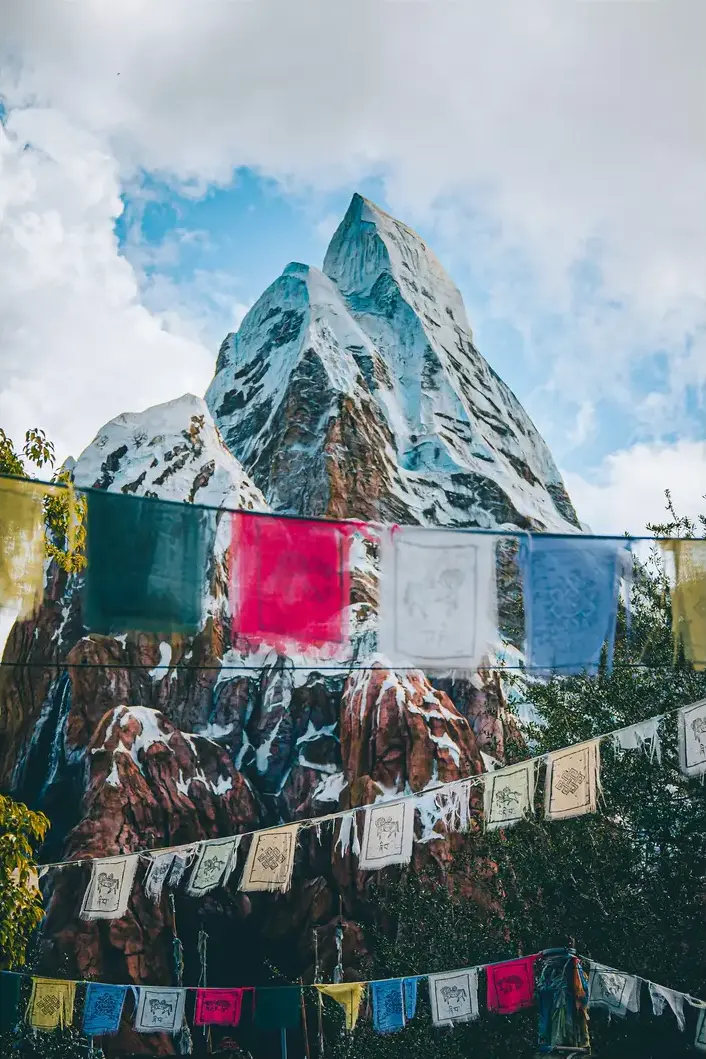 The complete Expedition Everest mountain and prayer-flag foreground