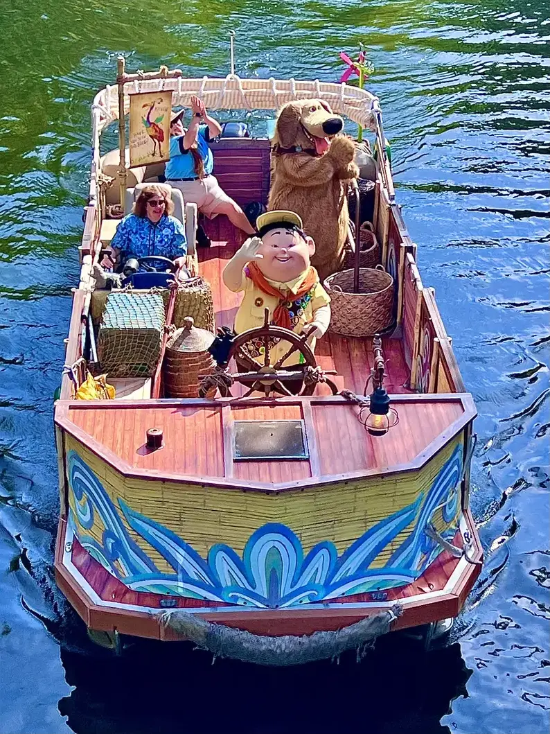 Russell and Dug fully visible on their colorful character flotilla