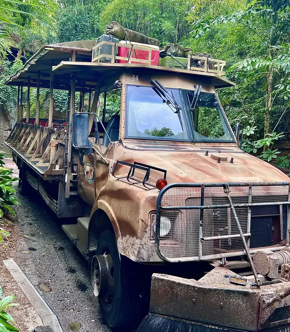 A full Kilimanjaro Safaris vehicle on a lush road