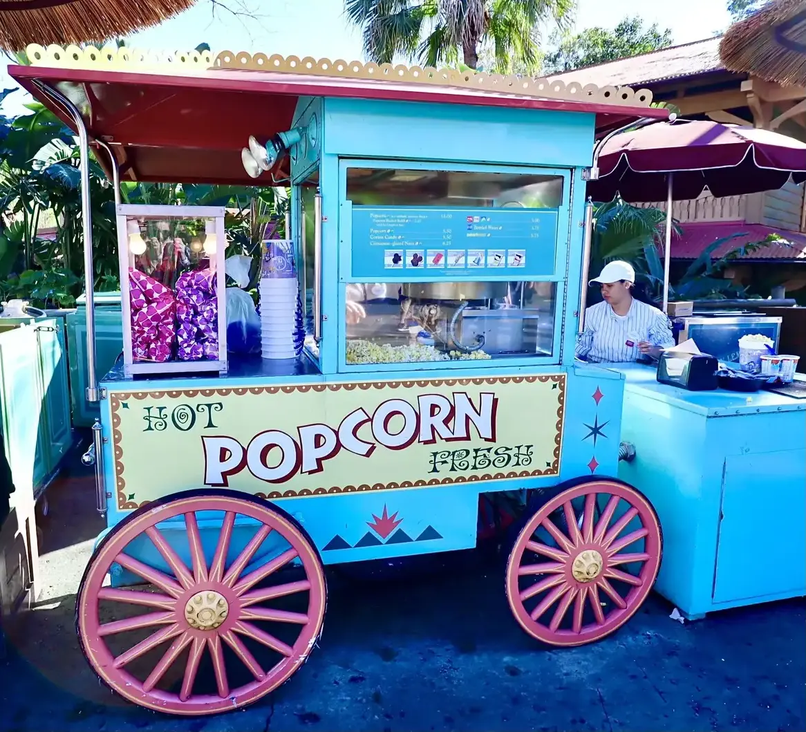 A colorful Main Street popcorn cart