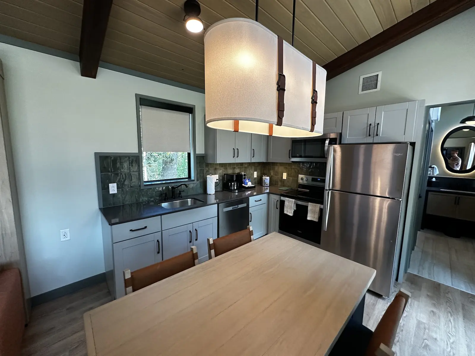The full kitchen and living area inside a new cabin at Disney’s Fort Wilderness Resort