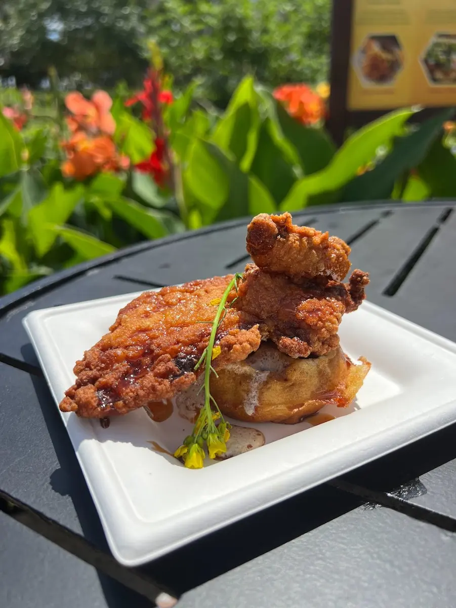 A plated chicken and waffle dish at Walt Disney World