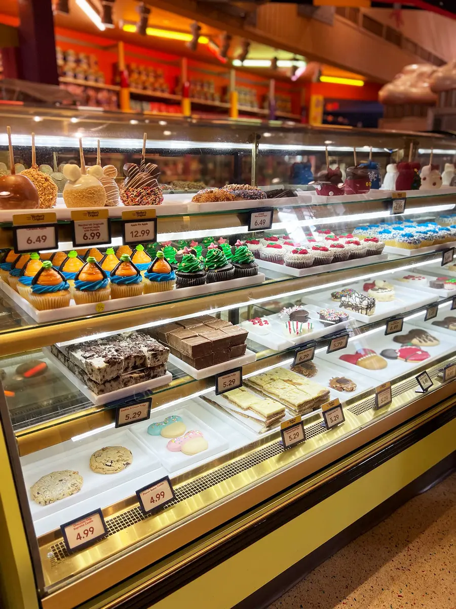 A colorful Disney bakery dessert case