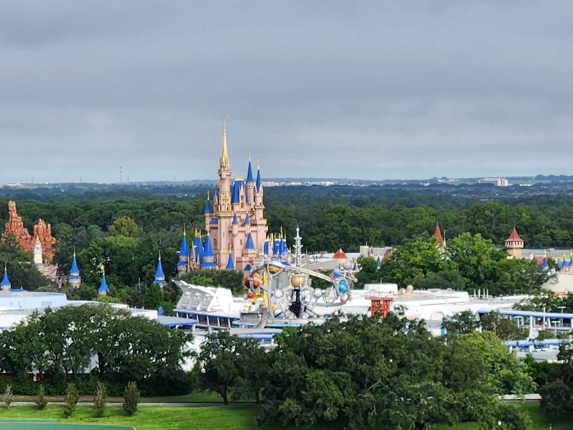 An aerial view of Magic Kingdom with Cinderella Castle rising above the park